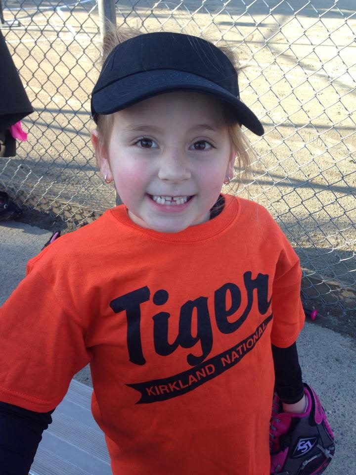 Anna as a young child playing tee-ball